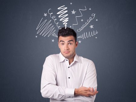 Young casual businessman with white scribbles around his head