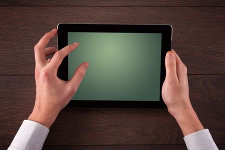 Caucasian business hands holding and working on plain tablet