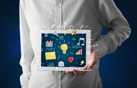 Casual businessman holding tablet with colorful apps 