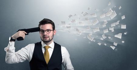 Handsome businessman shoots his head with gun and documents coming out from his head