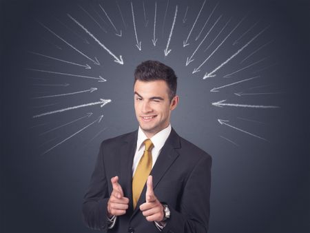 Young businessman with arrows pointing to his head 