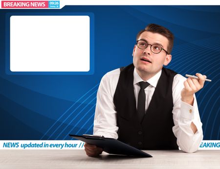 Television reporter telling breaking news at his studio desk with copy space concept