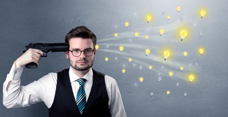 Man shoots his head with gun and idea bulbs are coming out from his head