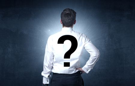 Businessman standing and thinking about questions