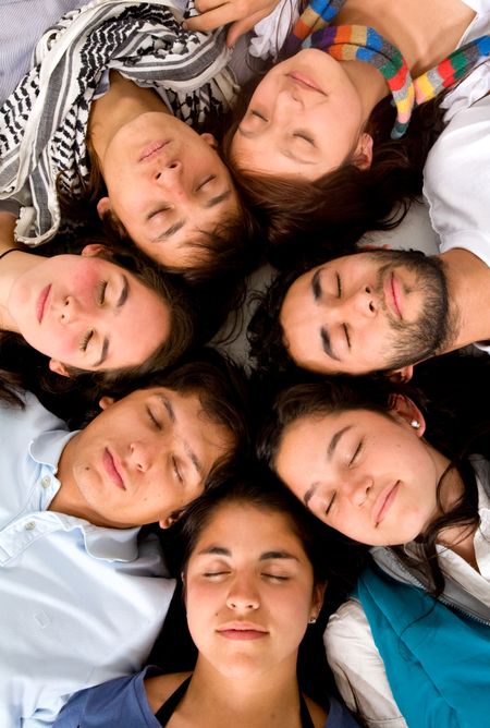 casual group of friends sleeping with their eyes closed