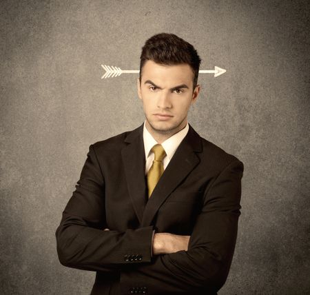 A confused young business guy giving thumbs up with a drawn arrow going through his head concept