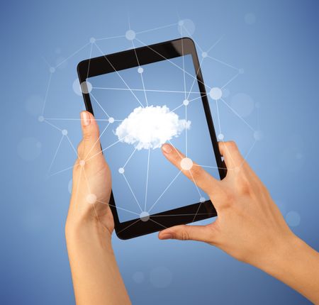 Female fingers touching tablet with cloud concept