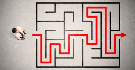 Lost businessman found the way in maze with red arrow on grungy background