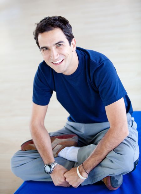 Handsome young man at the gym smiling