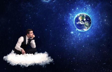 caucasian-businessman-sitting-white-fluffy-cloud-635161328 Caucasian businessman sitting on a white fluffy cloud looking and wondering at planet earth