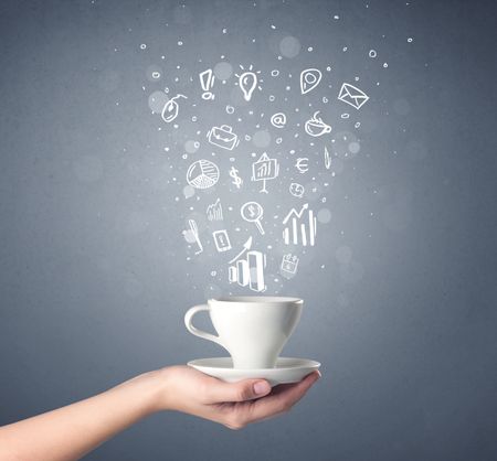 Young female hand holding coffee cup with business related drawings above it 