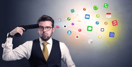 man-shoots-head-gun-application-icons-635195030 Man shoots his head with gun and application icons coming out from his head