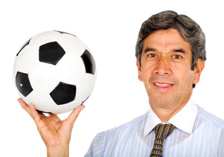 business man with a football symbolizing teamwork - isolated over a white background