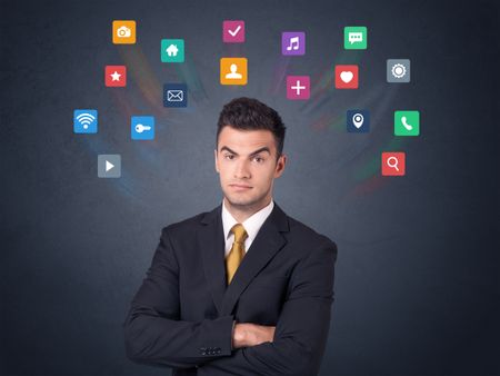 Young businessman with colorful applications over his head 