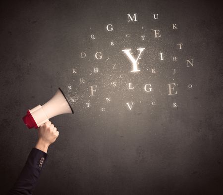 Caucasian arm holding megaphone with letter cloud