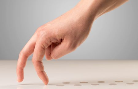 Female fingers walking with dots behind them