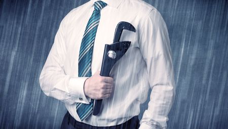 Young handsome  man holding tool with raindrop graphic