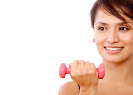 Beautiful girl exercising with free weights - isolated over a white background