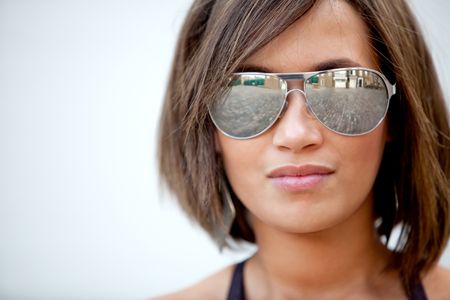 Portrait of a beautiful woman wearing sunglasses