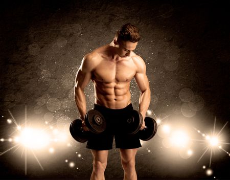 An attractive muscular guy working out with weights and showing naked upper body with illustrated lights and bokeh concept