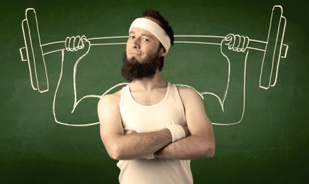 A young man with beard and glasses posing in front of green background, imagining how he would lift weight with big muscles, illustrated by white drawing concept.