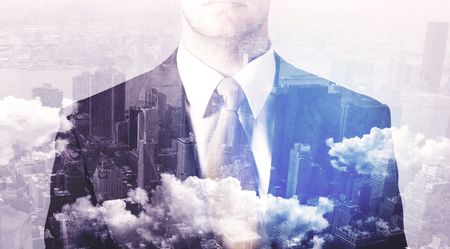Business man standing at city overlay view background 