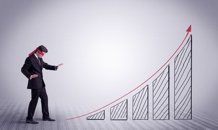 young-male-office-worker-trying-find-639415744 A young male office worker trying to find the right solution to develop a growing market concept with drawn exponential arrow.