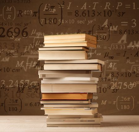 Books on vintage background with math formulas flying out