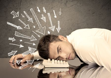 An exhausted business person resting his head on keyboard with pressure illustrated by arrows pointing at him concept