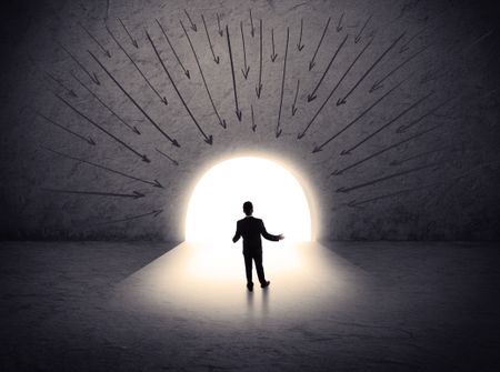 businessman standing in front of the huge gate with drawn arrows pointing to the entrance