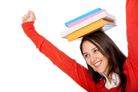 Excited student with books on top of her head - isolated over white