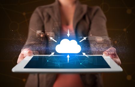 Casual young woman holding tablet with cloud concept