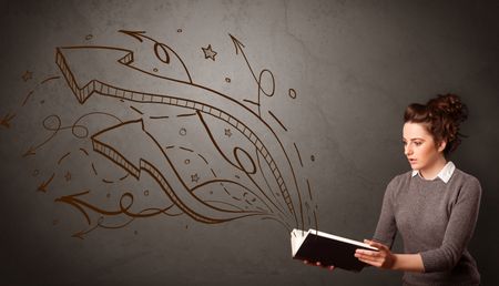 Casual young woman holding book with brown arrows and stars flying out of it