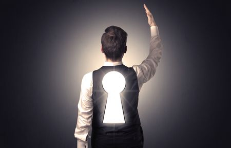 Young businessman standing and thinking with black keyhole on his back