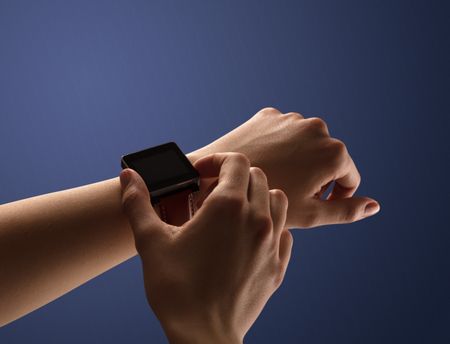 Close up female hand with smartwatch and dark background and black screen