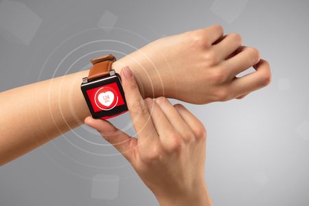 naked-female-hand-smartwatch-heart-rate-644341087 Naked female hand with smartwatch and with heart rate icon on the watch