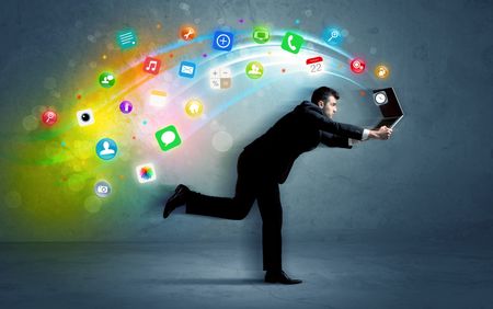 Running businessman with colorful application icons from media device