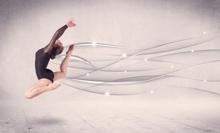 Ballet dancer performing modern dance with abstract lines concept on background