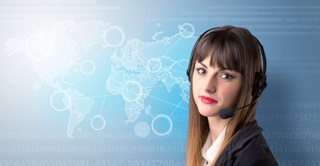 Young female telemarketer with blue background and world map and numbers behind her