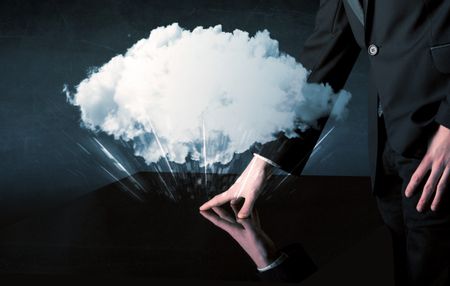 Male hands touching interactive table with a white cloud on it