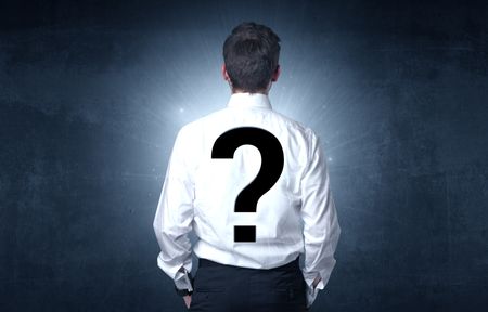 Businessman standing and thinking about questions