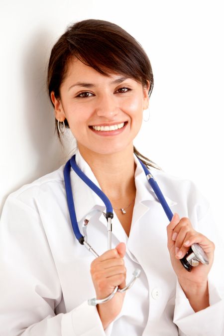 Young female doctor smiling over a white background