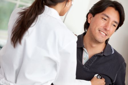 Female doctor examining a patient at the hospital