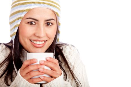 Winter woman drinking a cup of coffee - isolated
