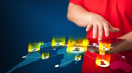 hand-holding-tablet-device-social-network-648417337 Hand holding tablet device with social network map concept on background