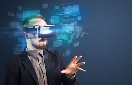 Amazed businessman with virtual reality data and blue squares in front of him 