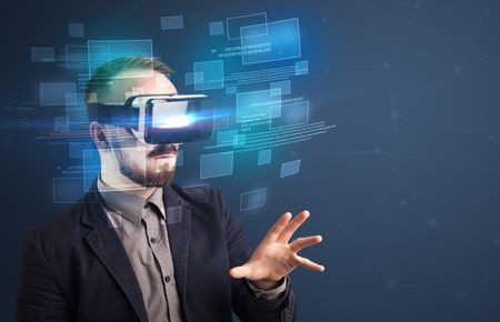 Amazed businessman with virtual reality data and blue squares in front of him