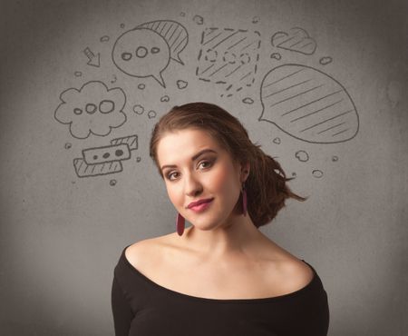 A cute female student making funny expressions with thoughts in her head illustrated by drawn chat bubbles on the urban wall background concept.