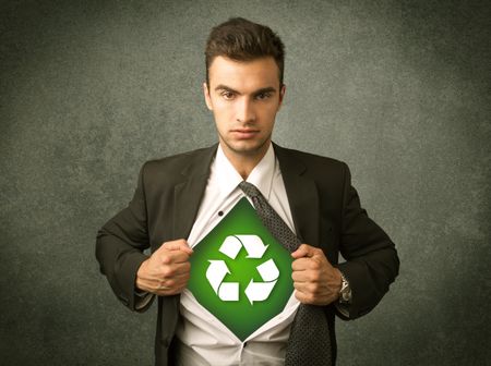 Enviromentalist business man tearing off shirt with recycle sign on his chest concept on backround