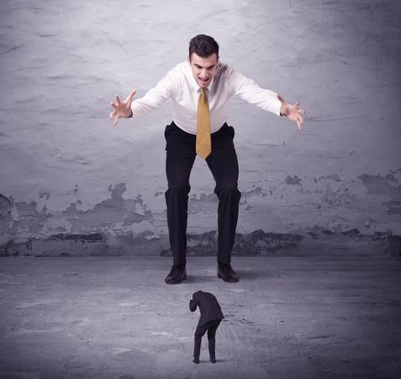 Angry big manager looking at small business man concept on background